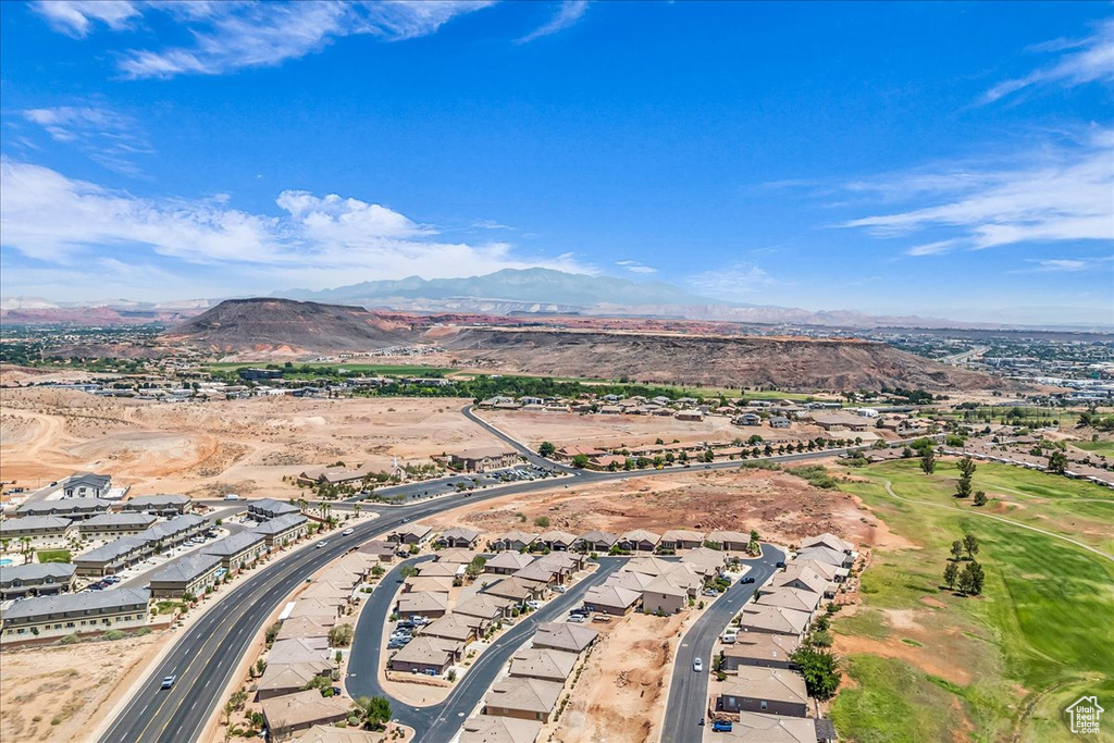 Aerial perspective of suburban area with a mountainous background