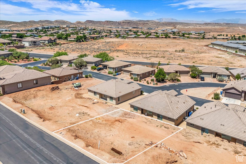 Aerial view of residential area featuring a mountainous background