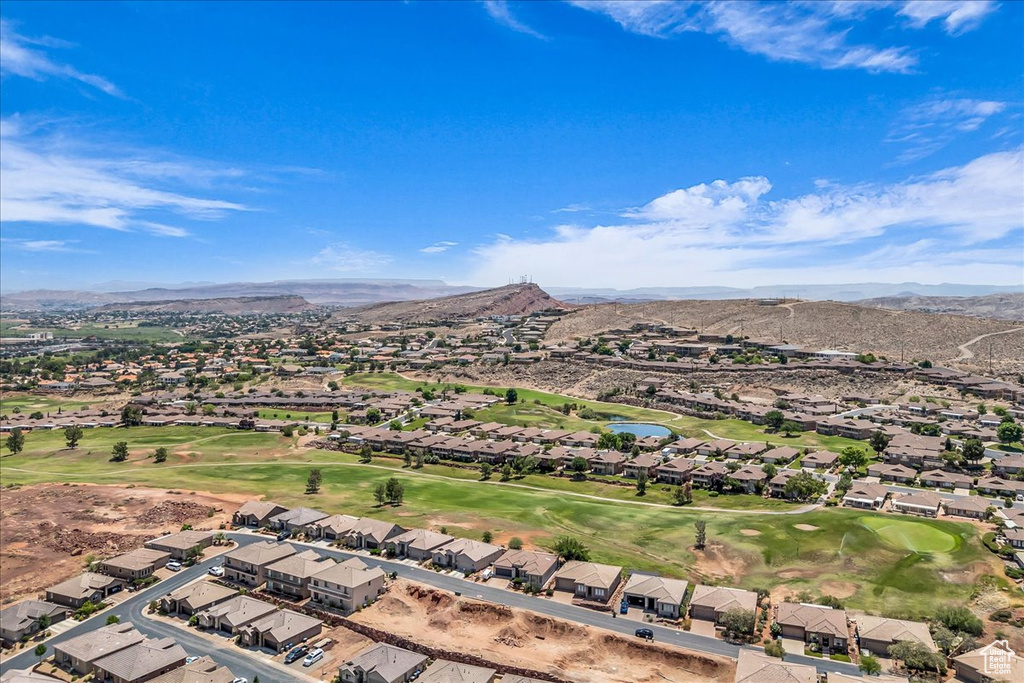 Aerial view of residential area with a local golf course and a water and mountain view