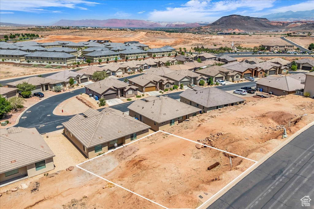 Aerial perspective of suburban area featuring a mountain backdrop