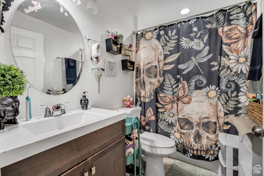 Full bathroom with vanity and a shower with shower curtain