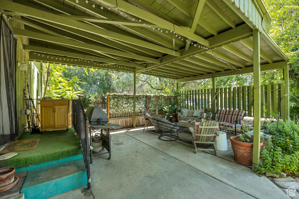 Fenced backyard featuring outdoor lounge area, a patio area, and grilling area