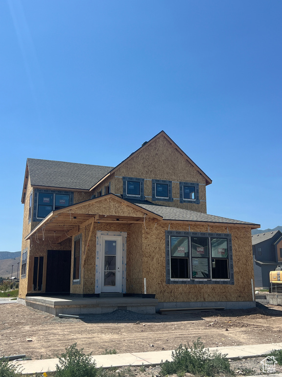 Property in mid-construction with roof with shingles