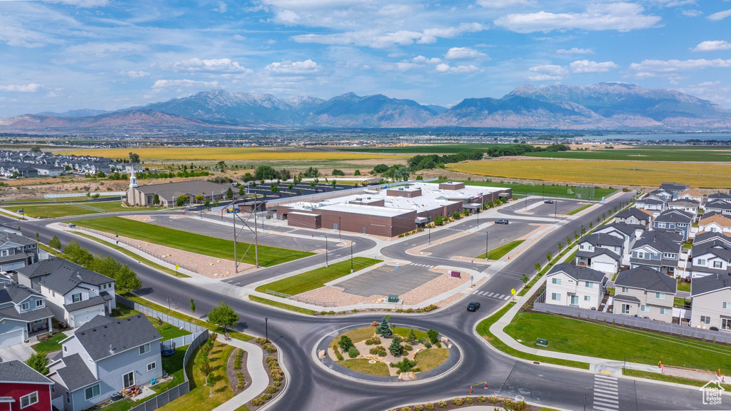 Aerial view of residential area featuring a mountainous background