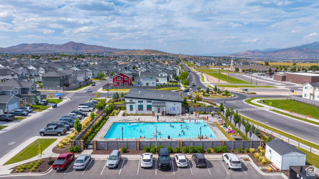 Aerial perspective of suburban area with a mountainous background
