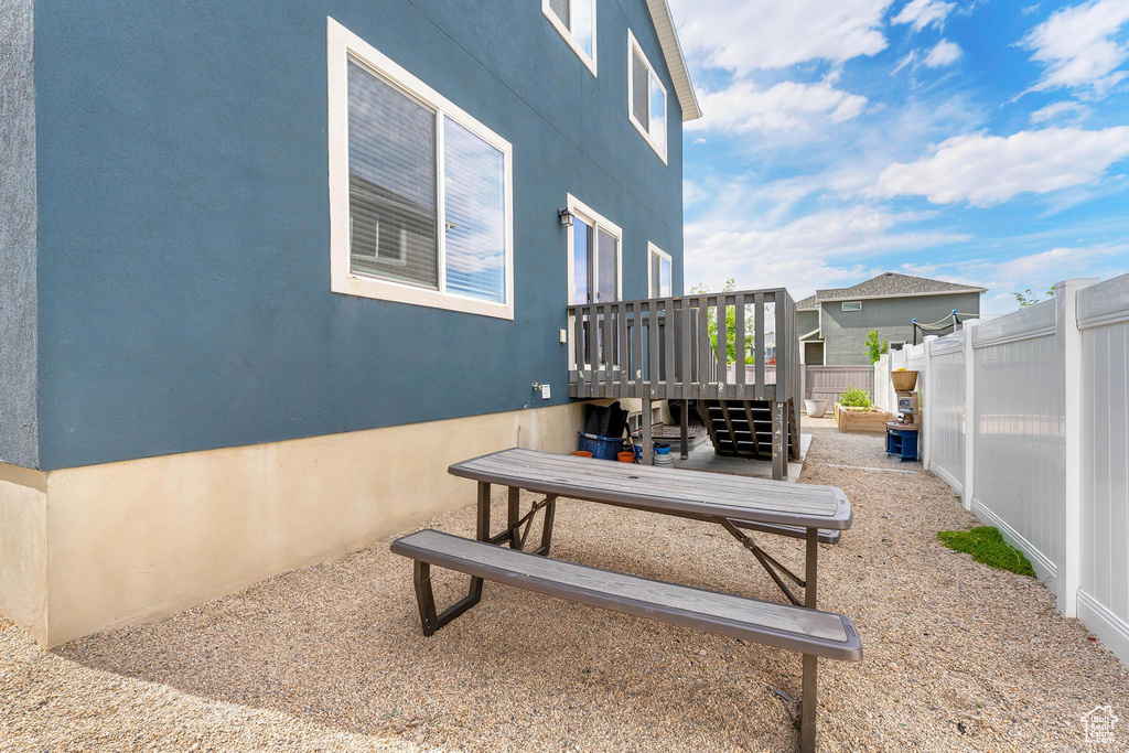 Fenced backyard featuring a wooden deck