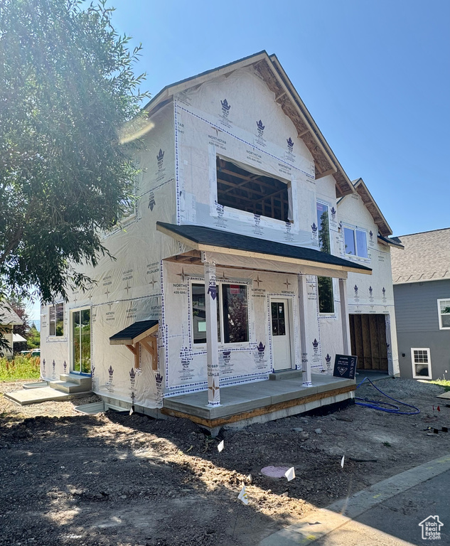 Unfinished property featuring covered porch