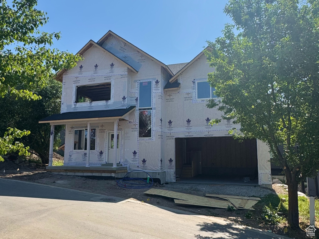 Property in mid-construction with a porch