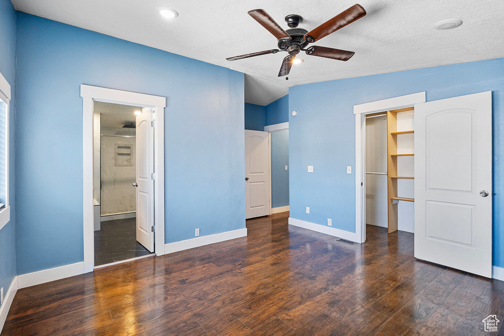 Unfurnished bedroom featuring wood finished floors, recessed lighting, ceiling fan, and ensuite bathroom