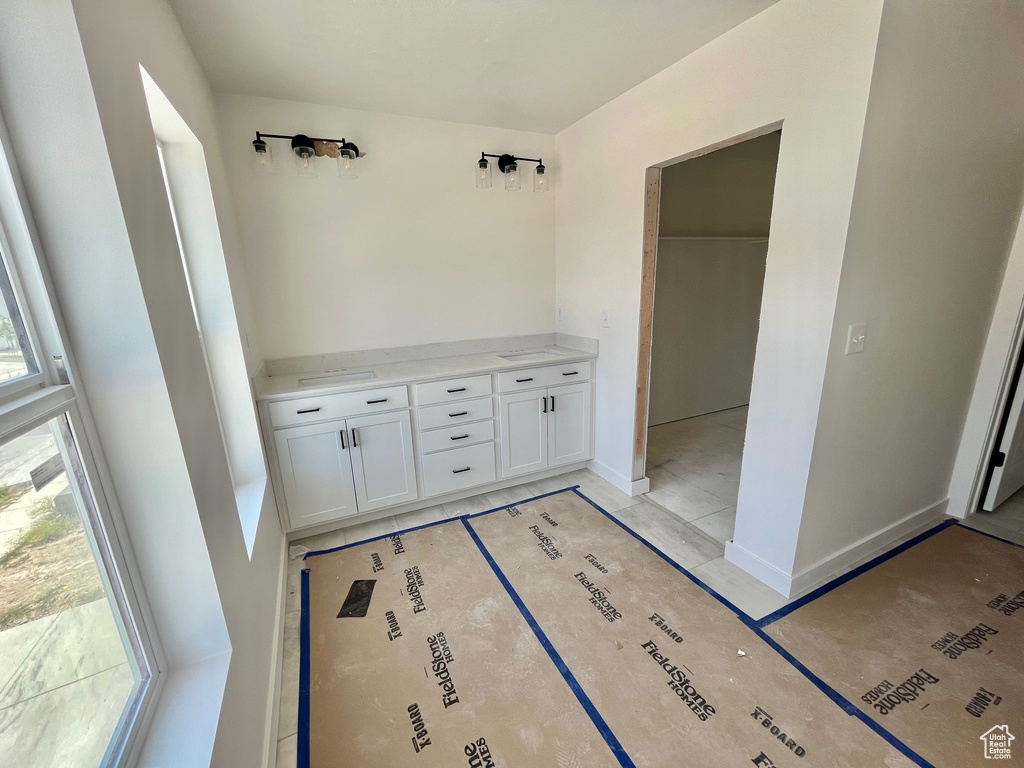 Bathroom featuring baseboards and vanity