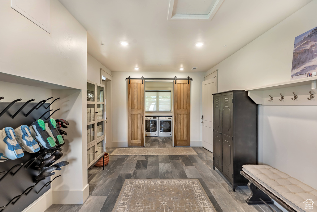Mudroom with washer and clothes dryer, dark wood-type flooring, recessed lighting, and a barn door