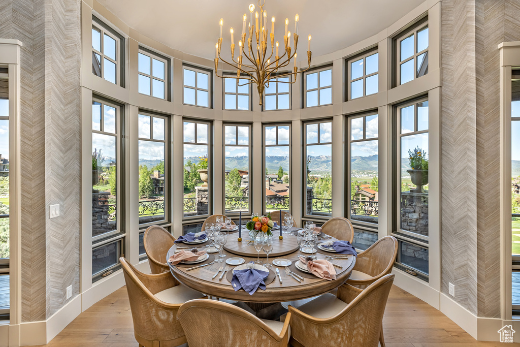 Sunroom featuring a chandelier