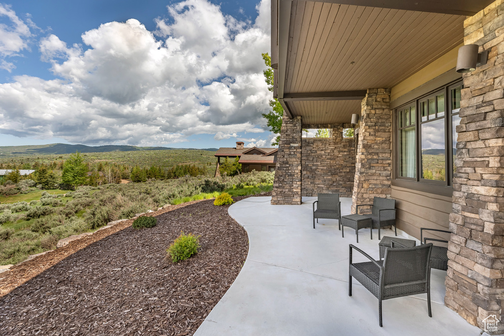 View of patio / terrace with a mountain view