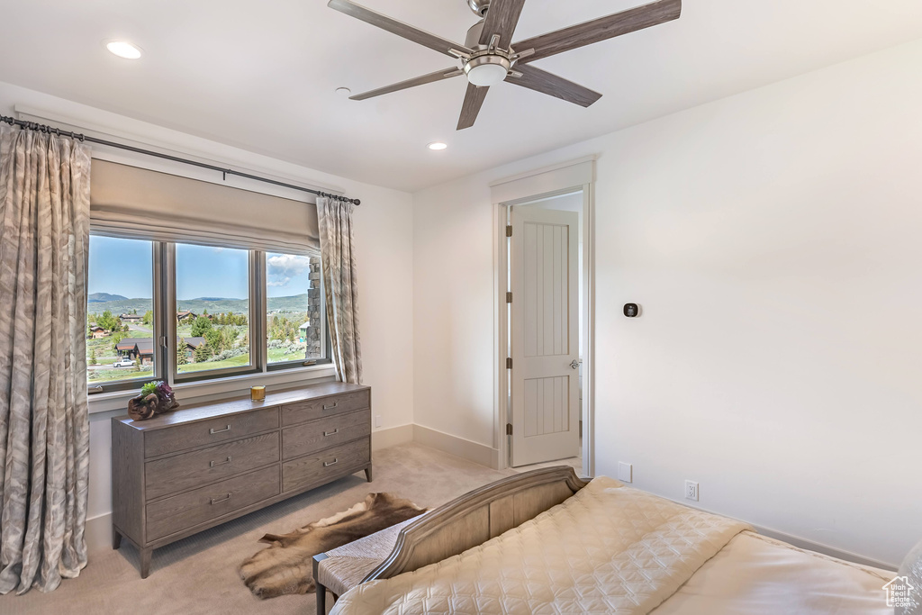 Bedroom featuring light carpet, recessed lighting, and a ceiling fan