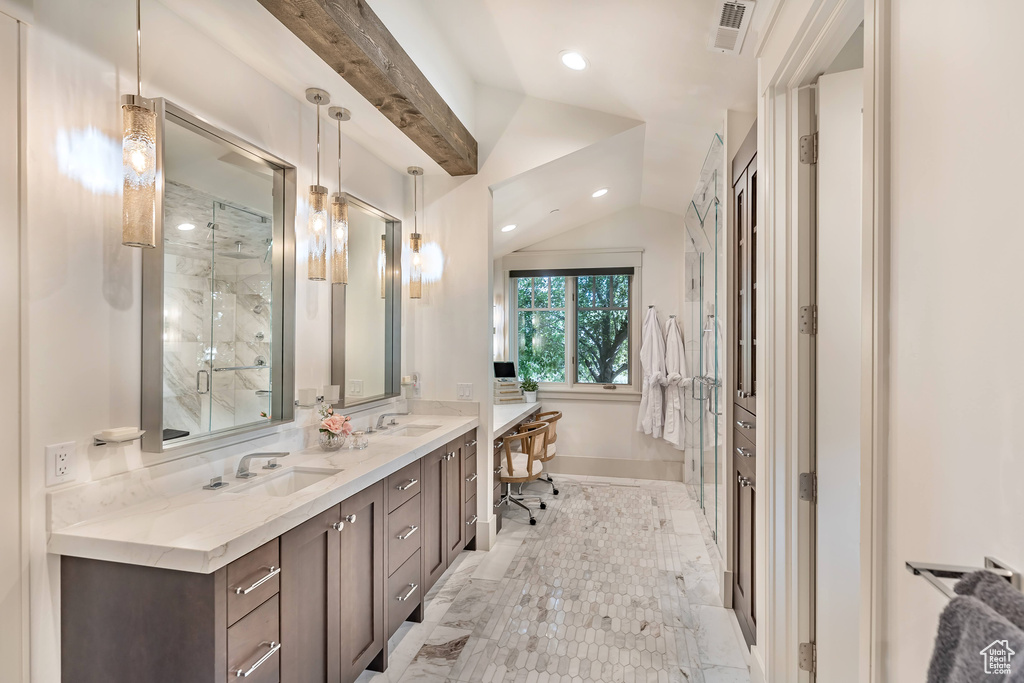 Full bath featuring vaulted ceiling, double vanity, a stall shower, and recessed lighting