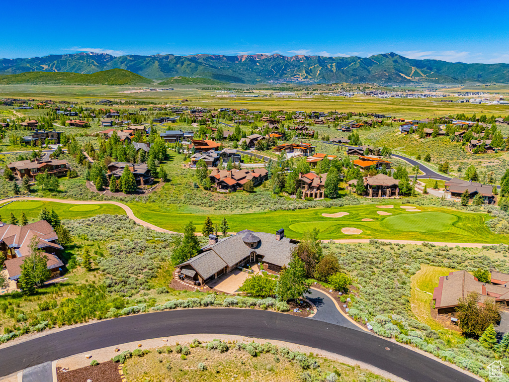 Aerial view of residential area featuring a mountainous background