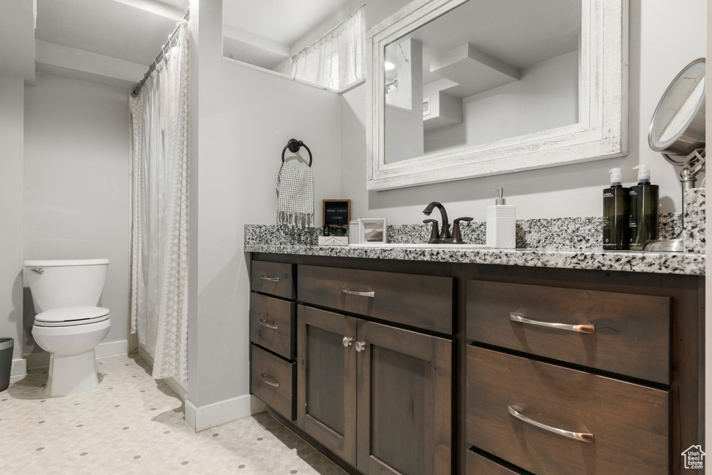 Bathroom with vanity and a shower with curtain