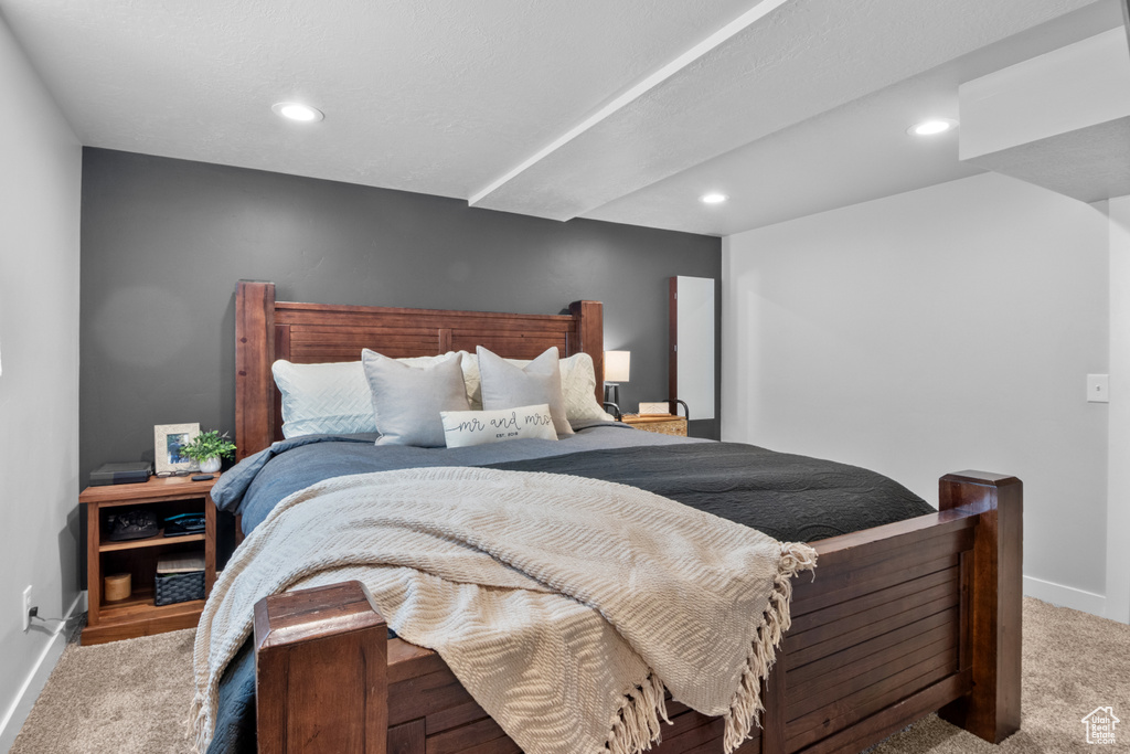 Carpeted bedroom with recessed lighting