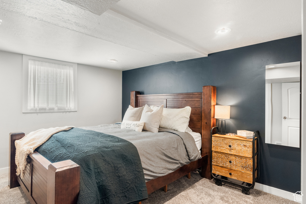 Carpeted bedroom with baseboards
