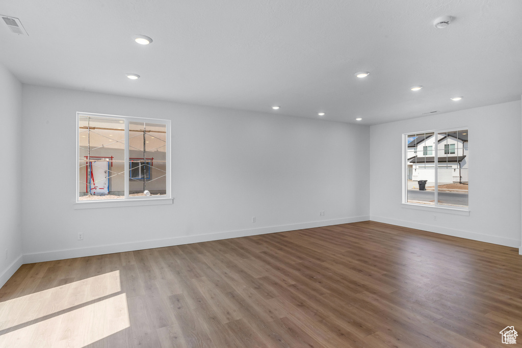 Spare room featuring a smoke detector, wood finished floors, and recessed lighting