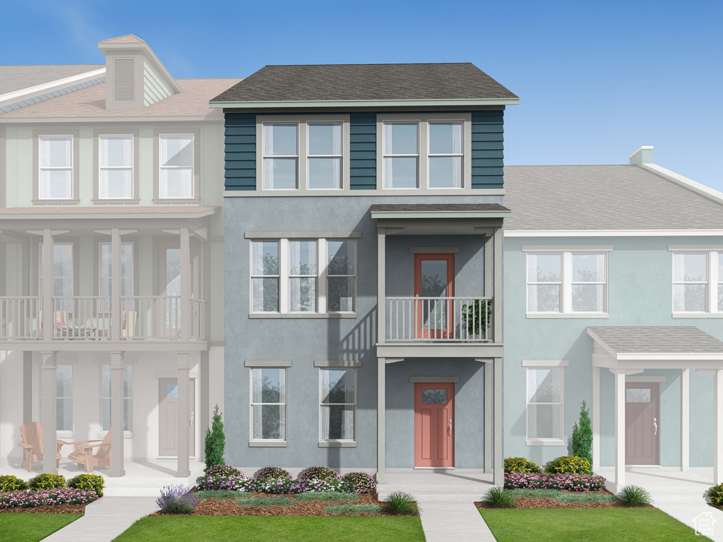 Townhome / multi-family property with stucco siding and a shingled roof