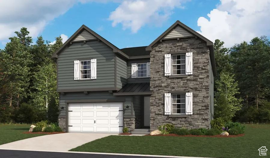 View of front of property with stone siding, a front lawn, driveway, a standing seam roof, and a garage