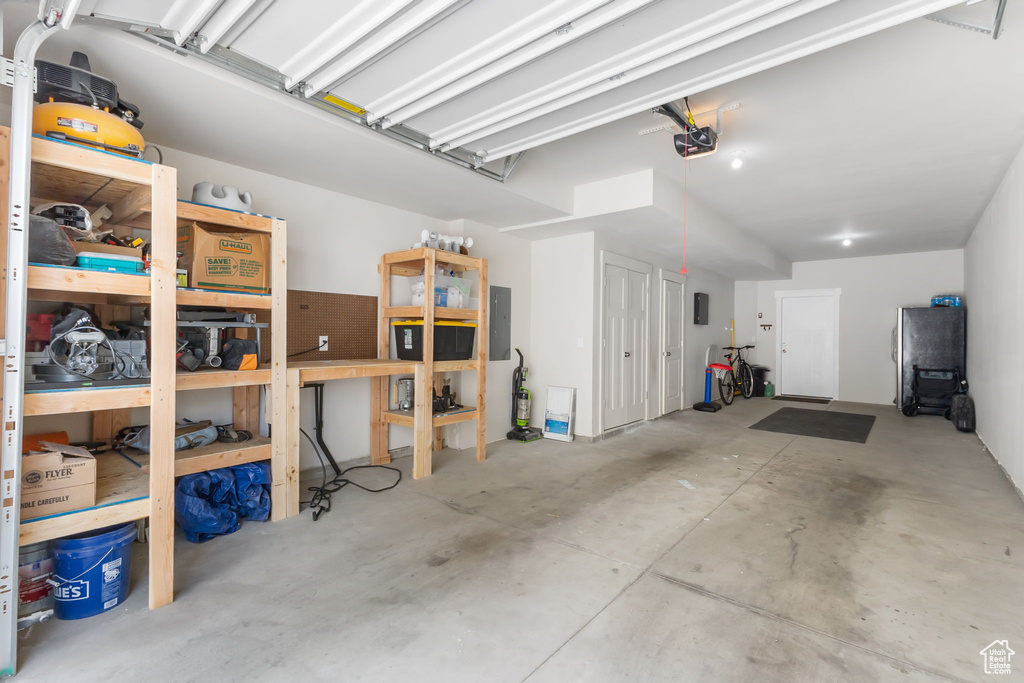 Garage with a garage door opener and electric panel