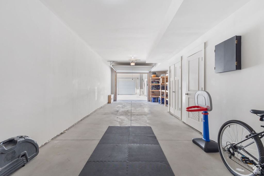 Corridor featuring concrete flooring