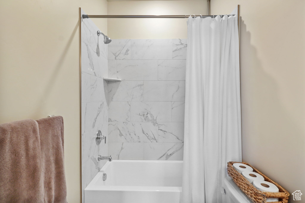 Bathroom with shower / bath combo and toilet