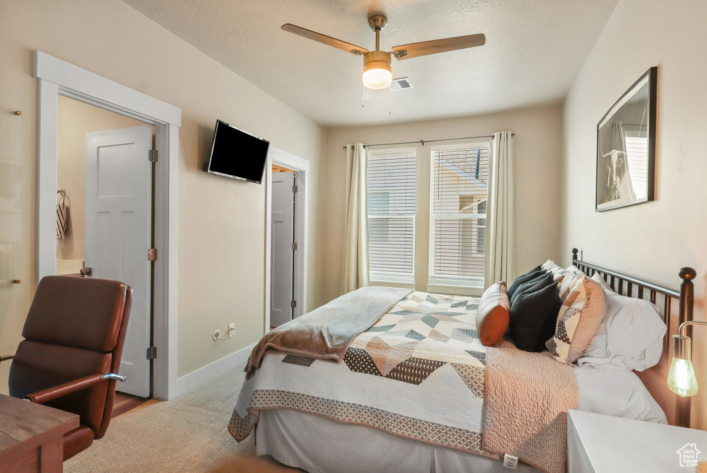 Bedroom featuring baseboards and ceiling fan