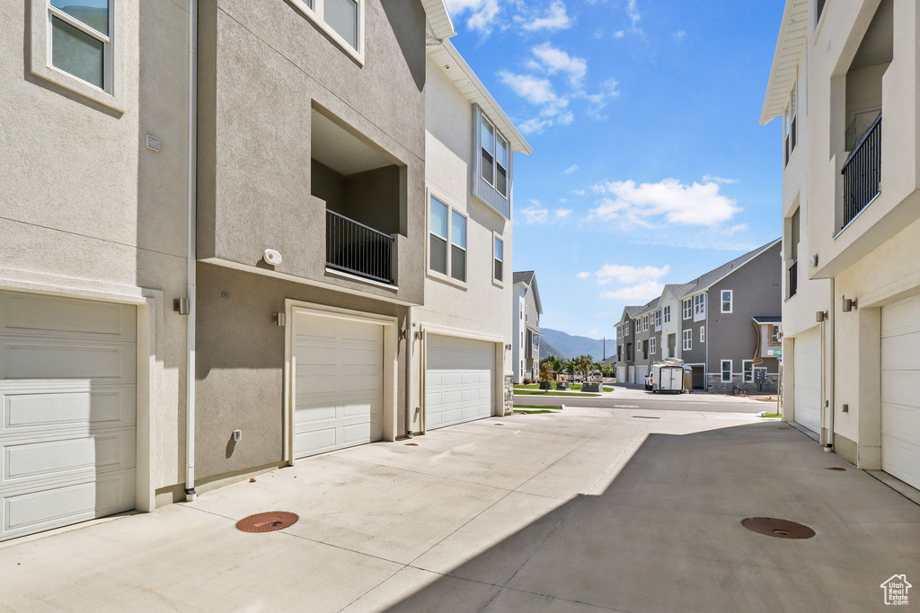 View of concrete road with a mountain view and a residential view