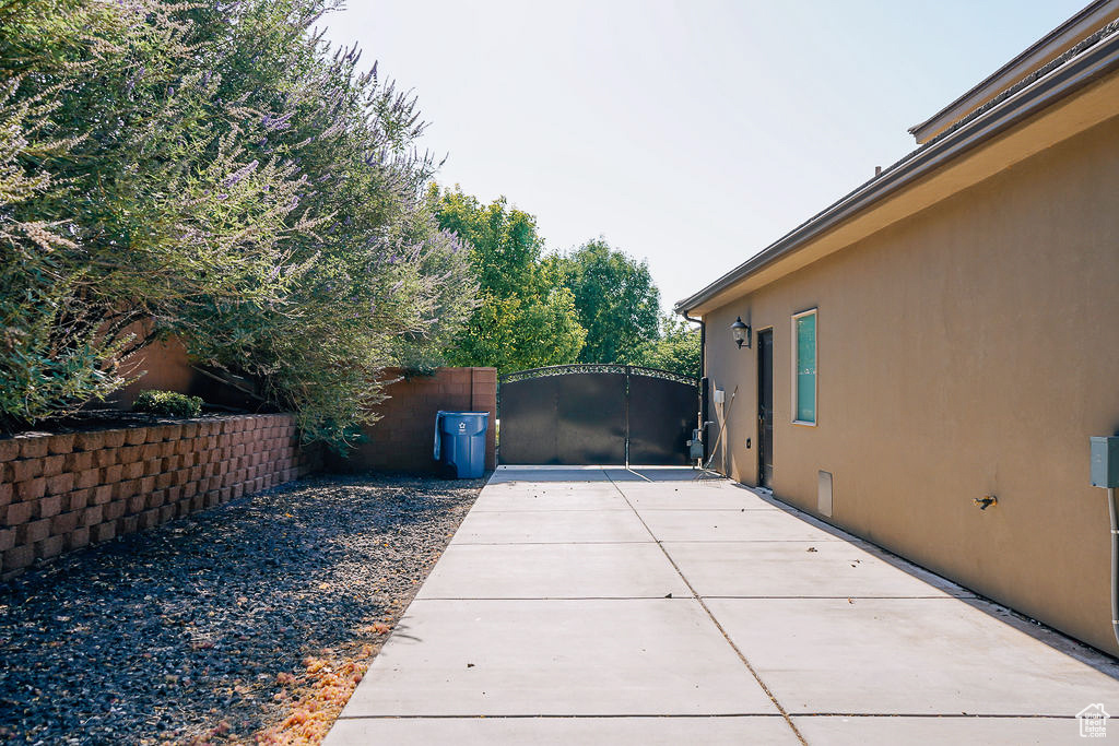 Gate featuring a patio
