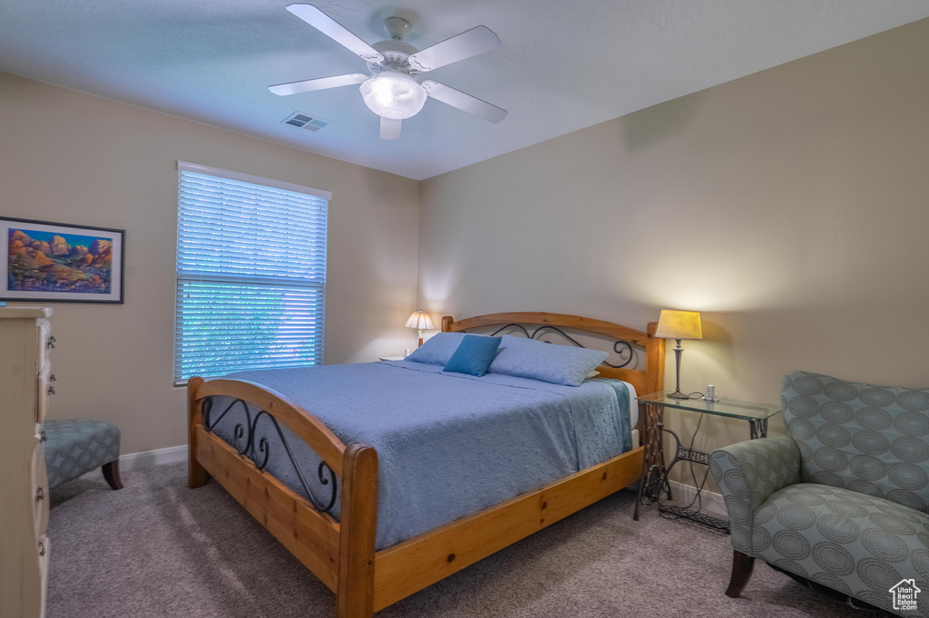 Bedroom with carpet floors and ceiling fan