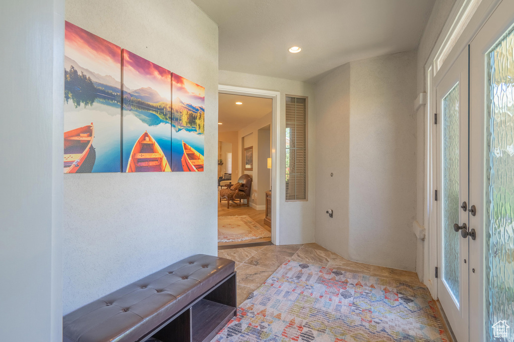 Entrance foyer with french doors and recessed lighting