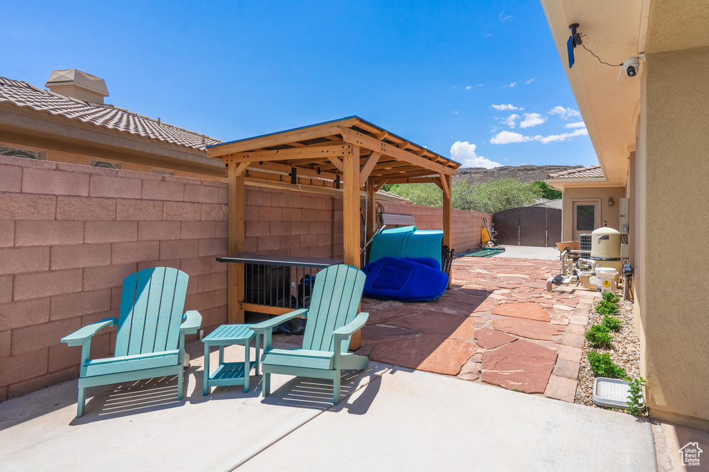Fenced backyard with a patio