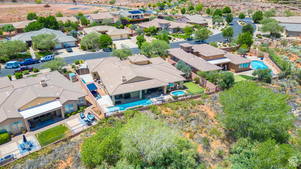 Aerial view of residential area featuring a pool area