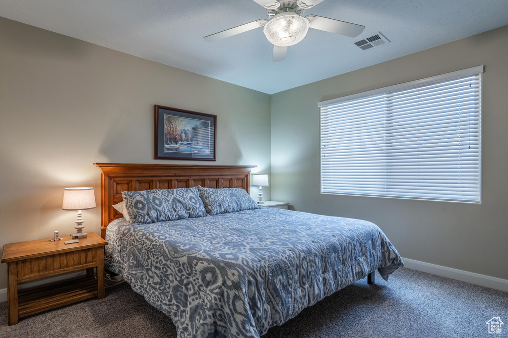 Bedroom featuring carpet floors and ceiling fan
