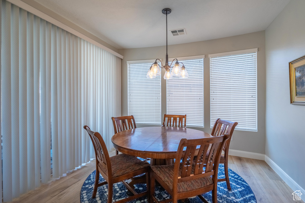Dining room featuring a chandelier and light wood finished floors