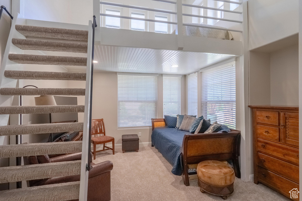 Carpeted bedroom featuring baseboards