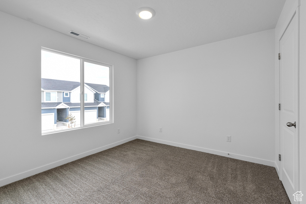 Unfurnished room featuring carpet floors