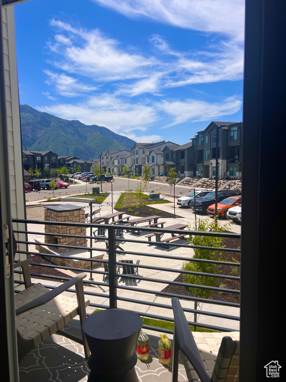 Balcony with a residential view and a mountain view