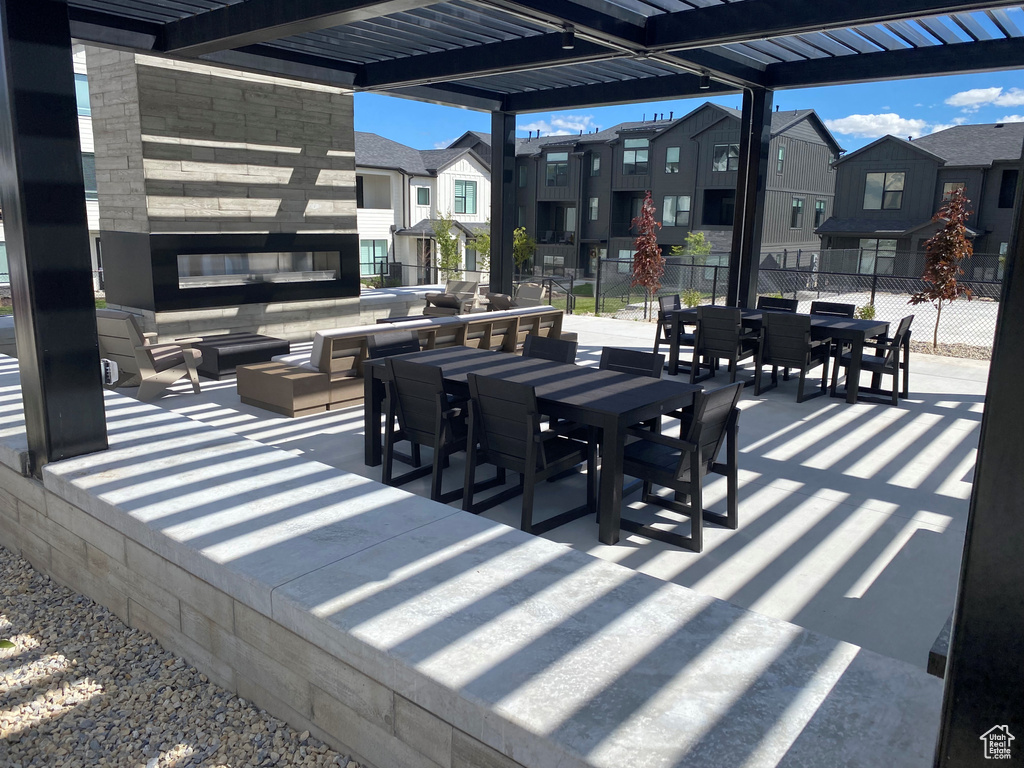 View of patio / terrace featuring an outdoor living space, a residential view, and outdoor dining space