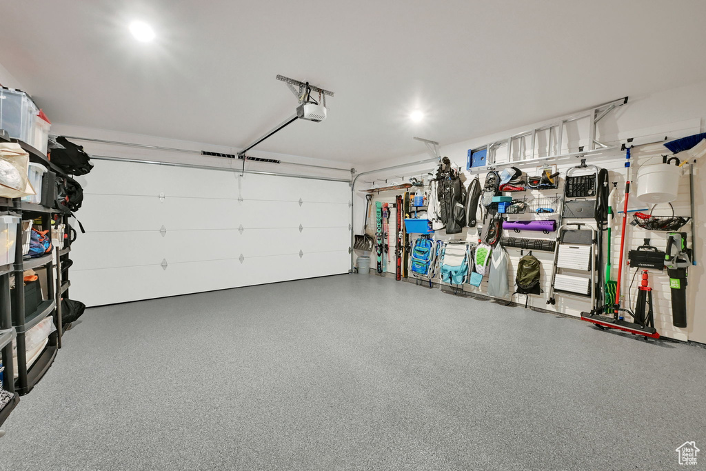 Garage featuring a garage door opener