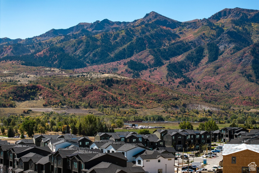 View of mountain backdrop featuring nearby suburban area
