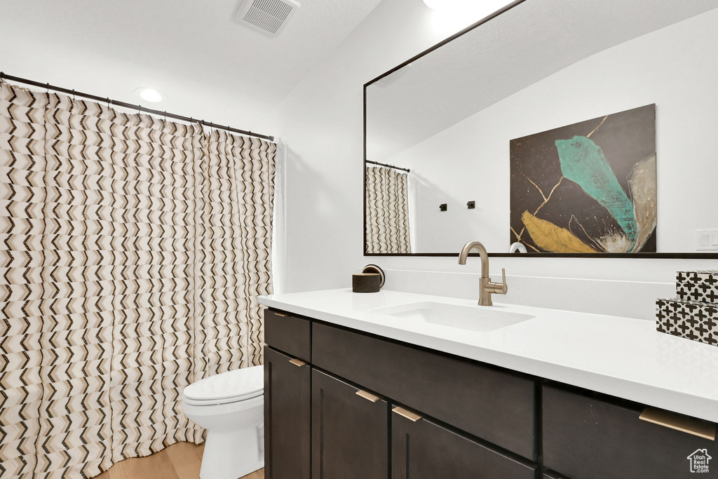 Bathroom with vanity and wood finished floors