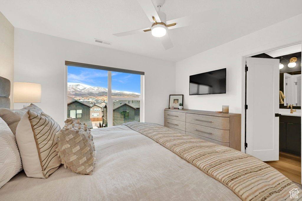 Bedroom featuring a sink and ceiling fan