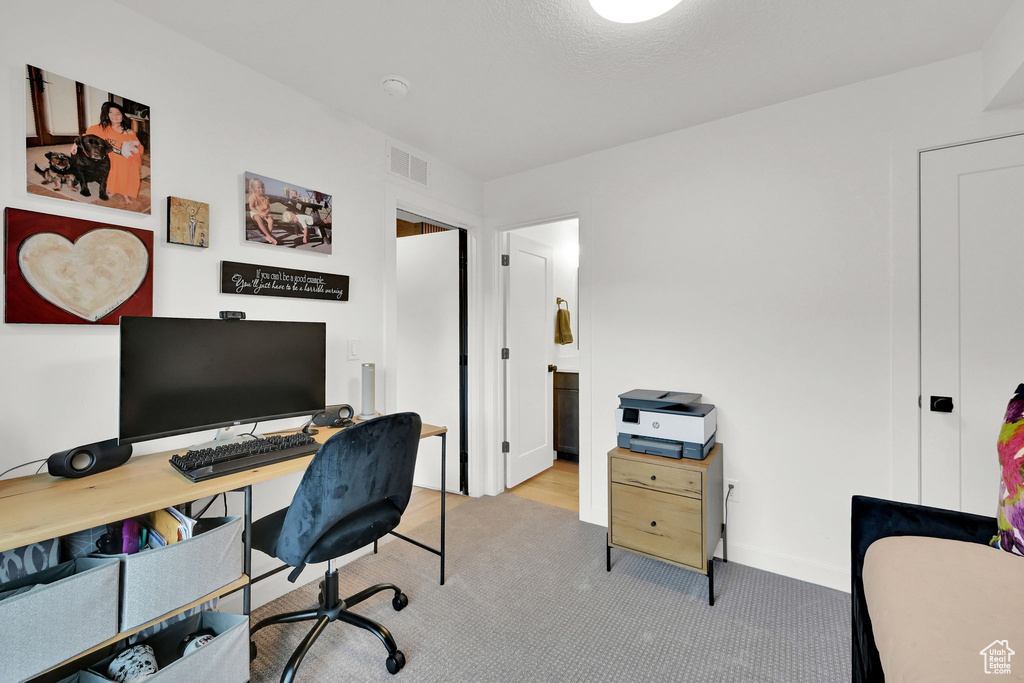 Office featuring carpet floors and baseboards