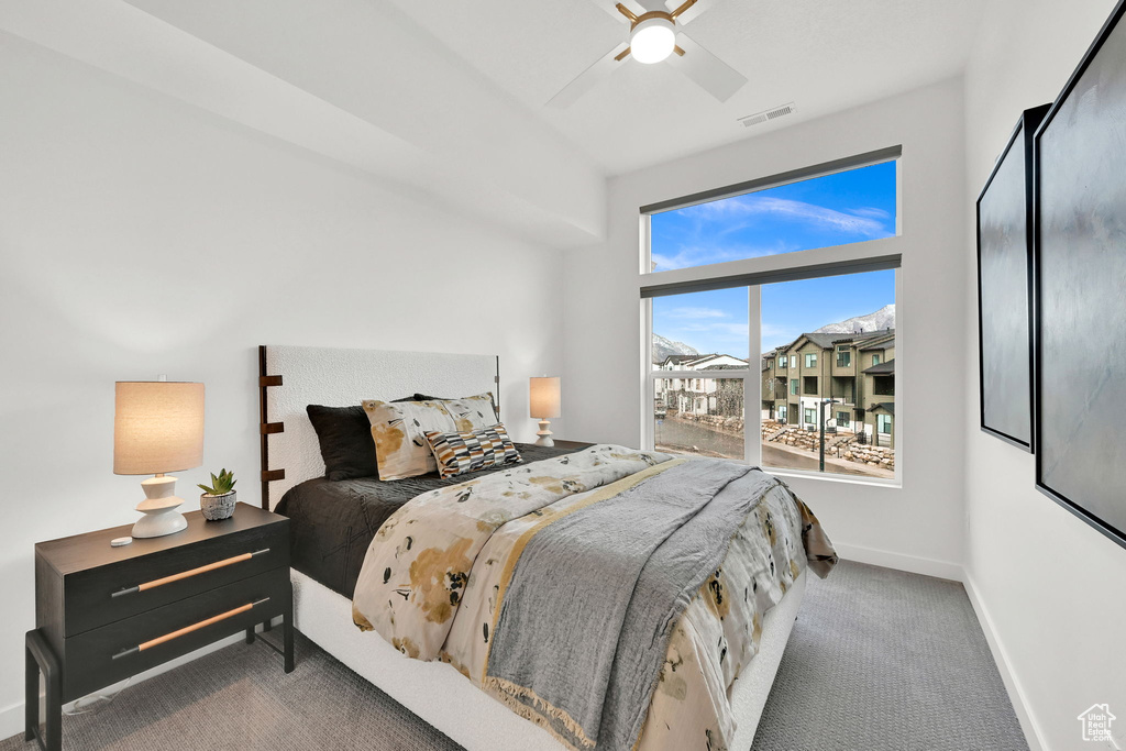 Bedroom with carpet floors and a ceiling fan