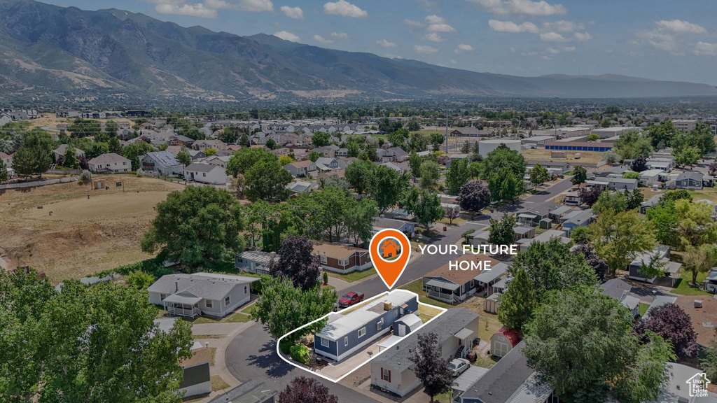 Aerial perspective of suburban area featuring a mountainous background