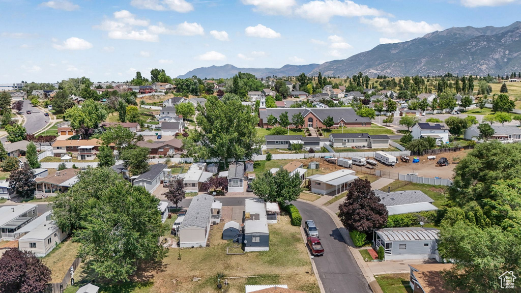 Aerial view of residential area featuring a mountainous background
